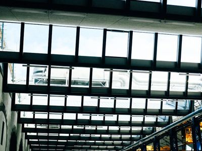 View of a bright exercise hall with large windows